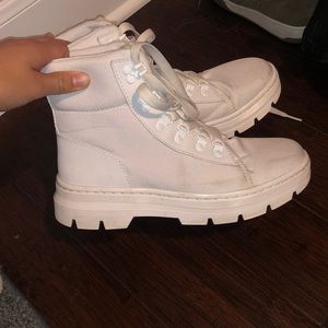 Doc marten combat boots. There are a few areas of discoloration. Size 8